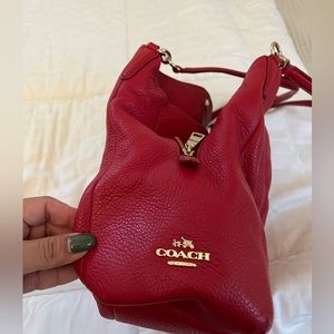 Red leather coach bag used inside has regular use leather in good condition.